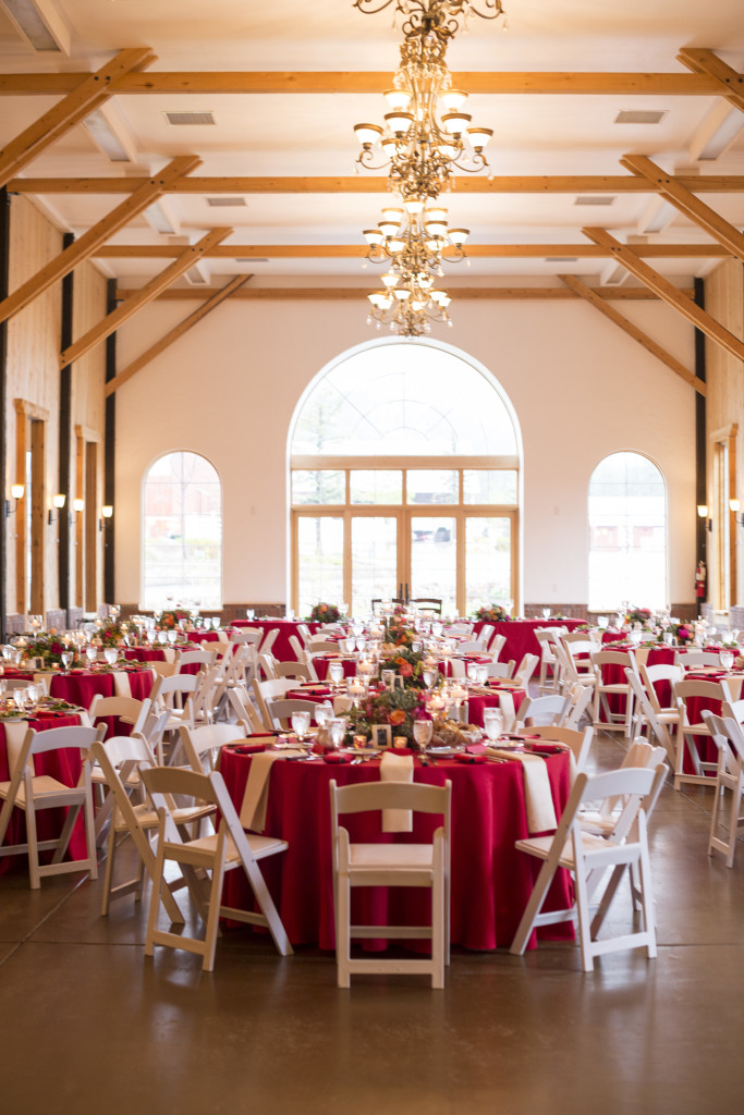Reception at Crooked willow farms, white chairs and red table linens