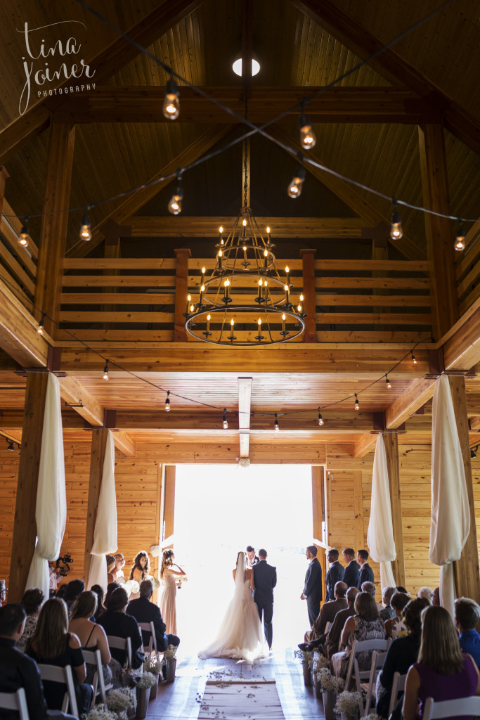 Wedding Ceremony inside the barn at Flying Horse Ranch