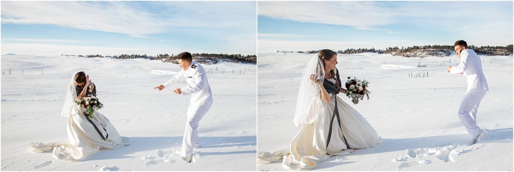 bride and groom have a snowball fight in a field of deep snow