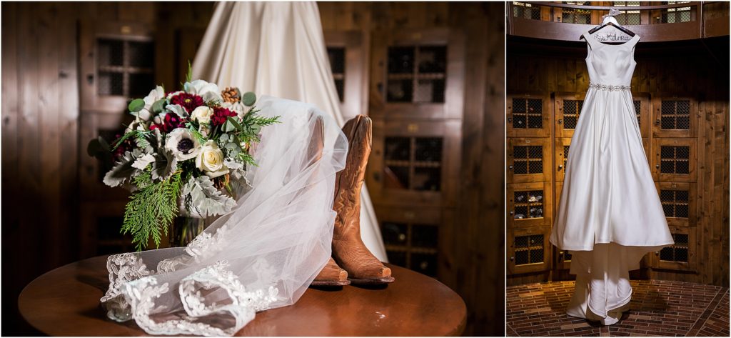 brides wedding gown hangs in the wine cellar at Flying Horse Club and her bouquet, boots and veil sit in front on a table