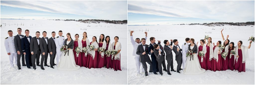Bride and groom with bridal party wearing military uniforms, grey, white, and burgundy in a field of fresh snow at flying horse ranch