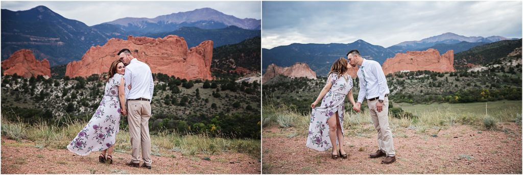 Engaged couple at Mesa Overlook with Garden of the Gods and Pikes Peak behind them.