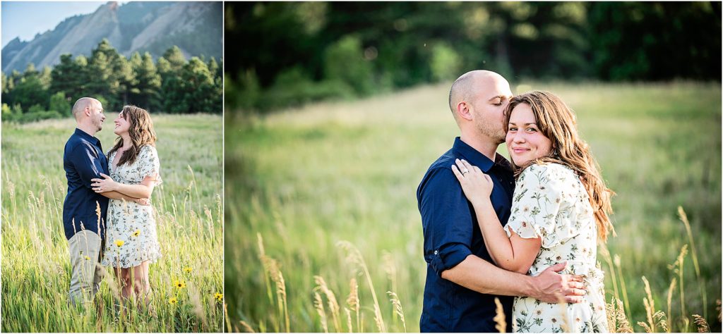 Jared and Rachael stand and embrace and look at each other smiling, they are standing in a meadow near Denver, Colorado