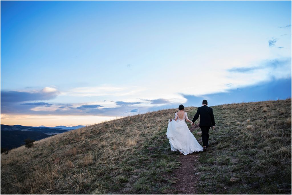 Cameron and Emily hike on their wedding day for amazing views.
