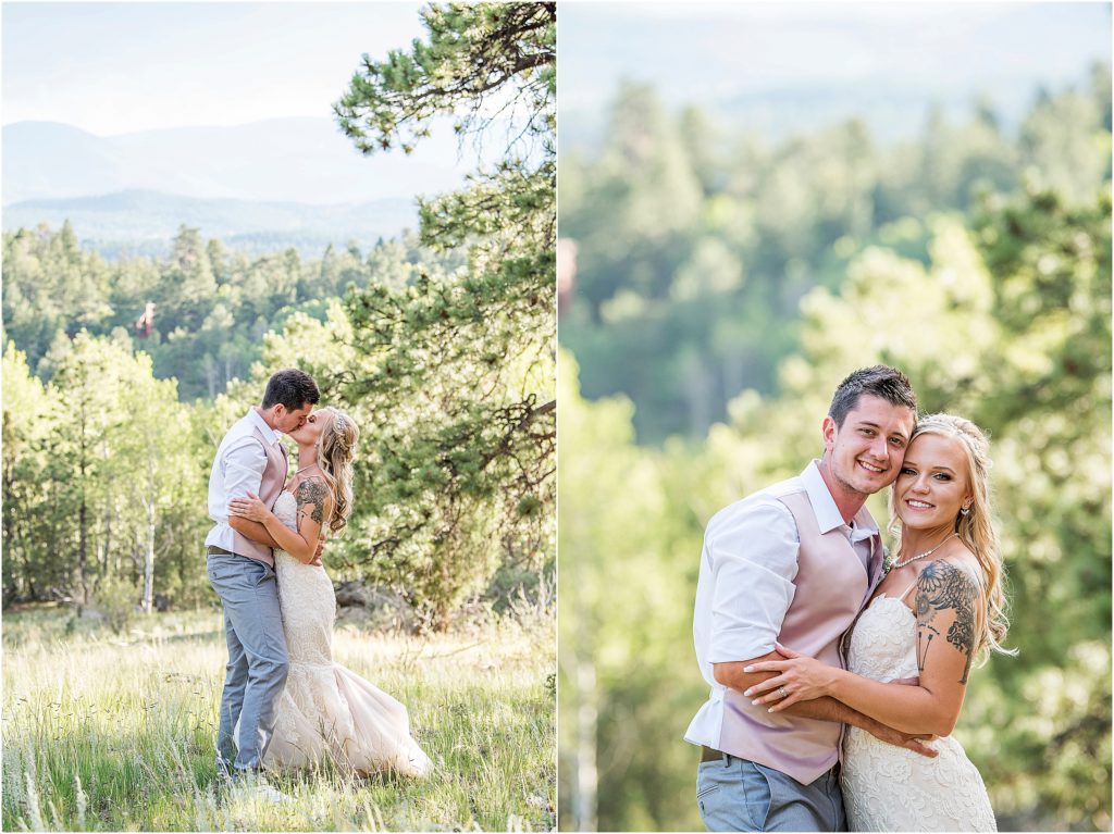Derek and Breanda stand in field with evergreens and mountain views in colorado