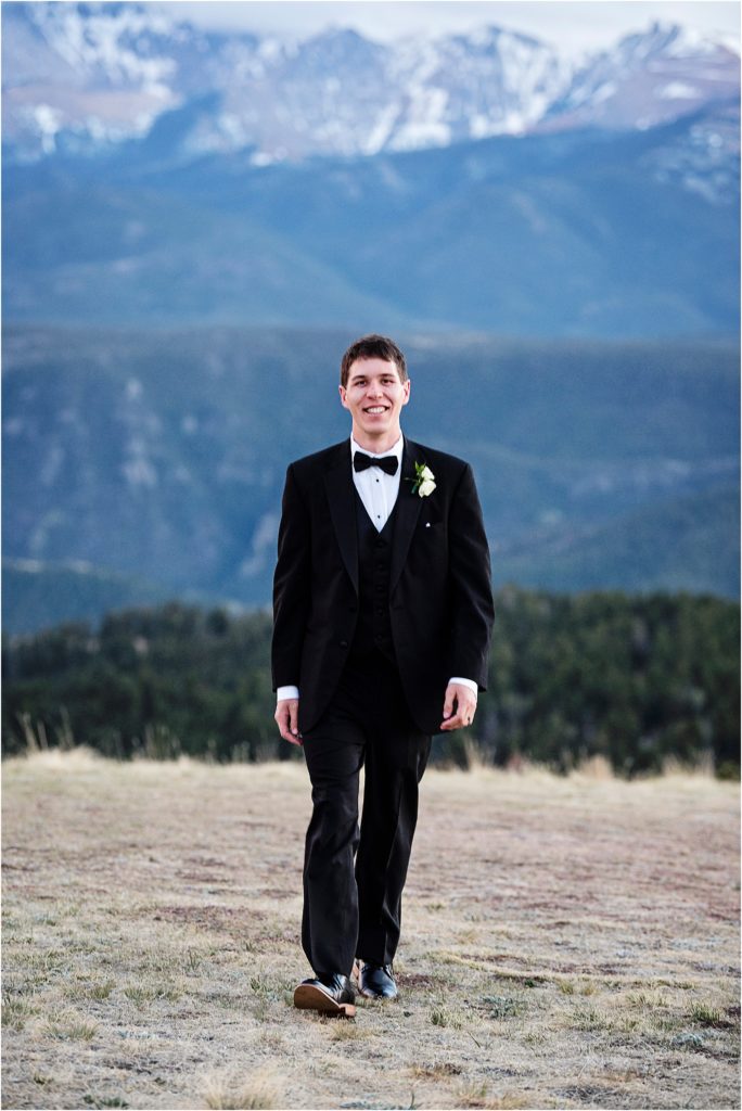 Camren in his tuxedo with mountain views on his wedding day.