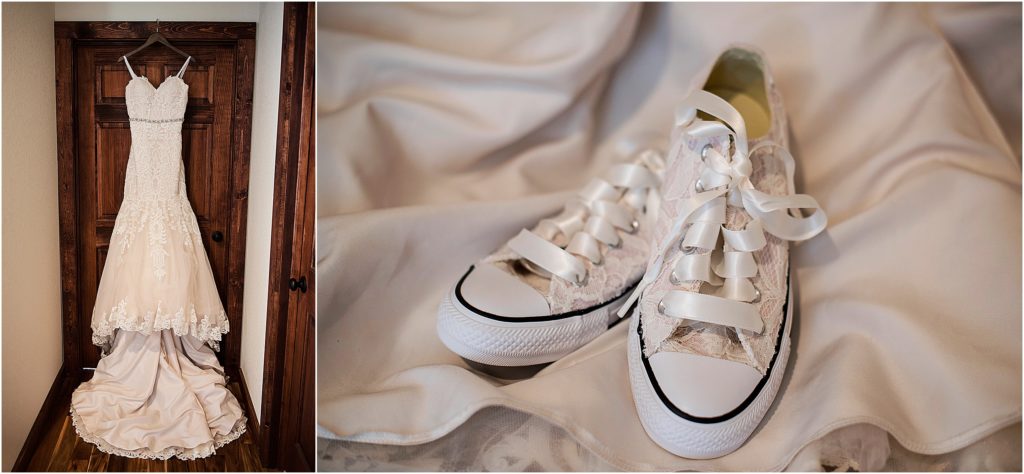 bride's dress hanging from a door frame and her lace converse.