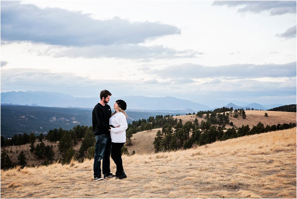 Andrew and Martha share a moment together in the colorado rocky mountains during their adventure engagement session