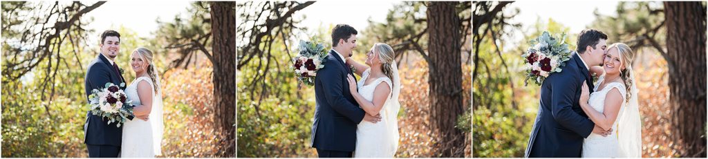 Josh and Sarah stand and embrace during their fall wedding near Castlerock, Colorado