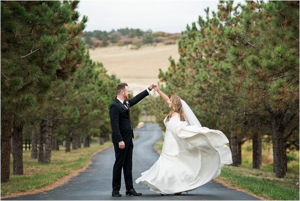Bride and groom dance at a ranch in autumn.