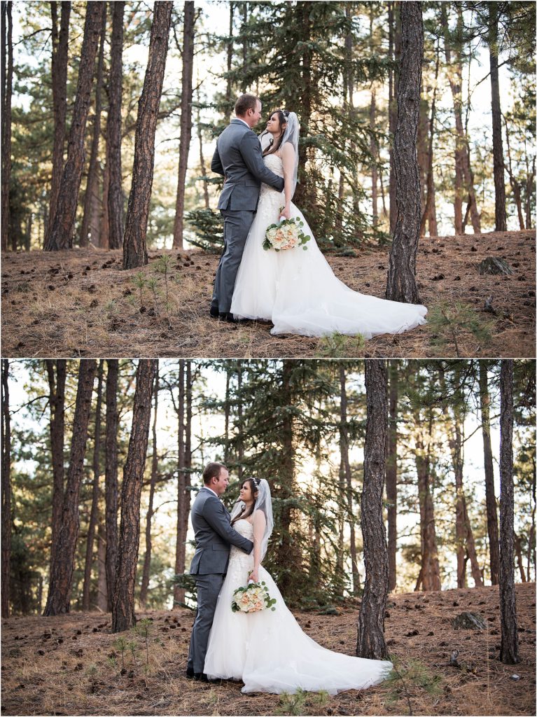 Ryan and Amanda stand and embrace on their wedding day surrounded by trees in a forest.