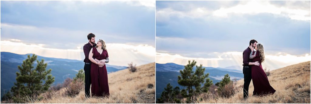 Andrew and Martha stand and embrace in the Colorado mountains near Woodland Park near sunset
