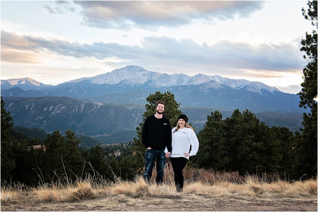 Colorado couple standing with Pikes Peak behind