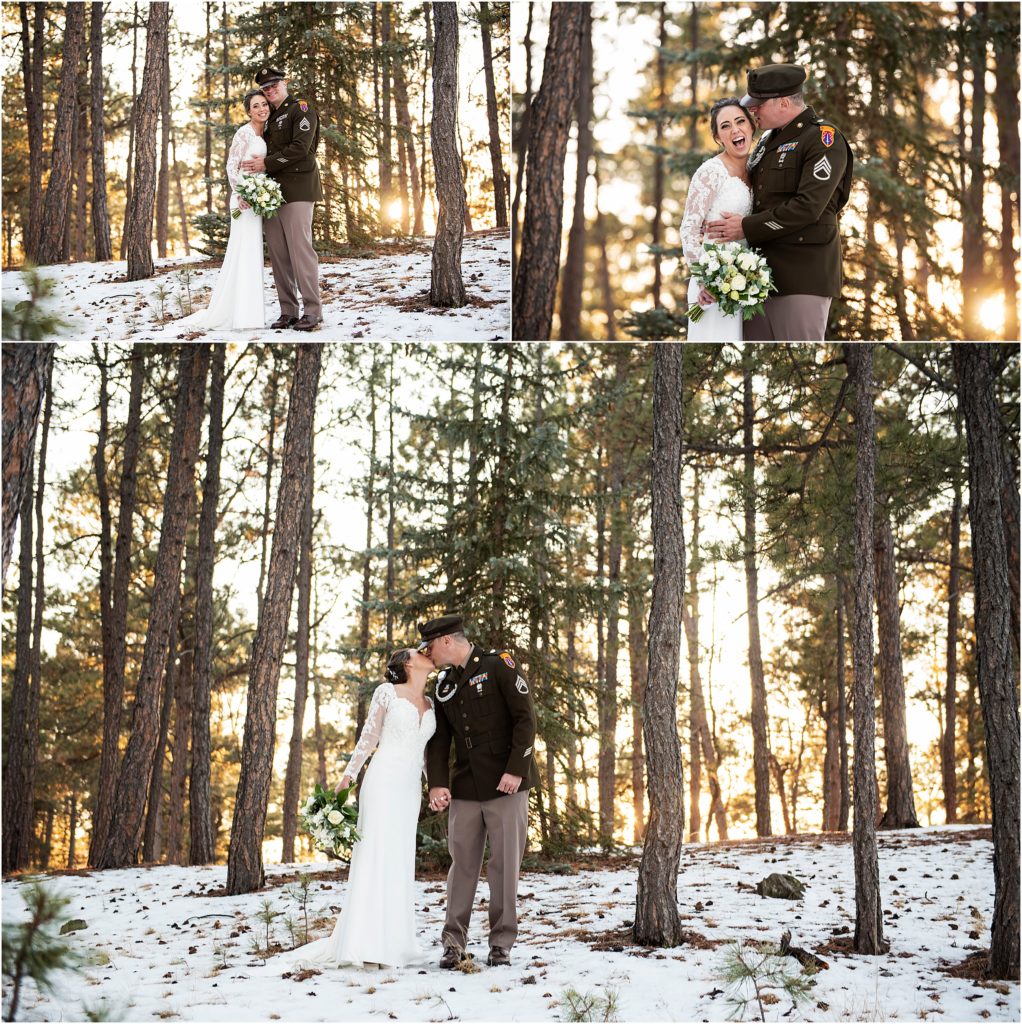 Bride and groom stand in snow in a forest as they take wedding photos as the sun goes down.