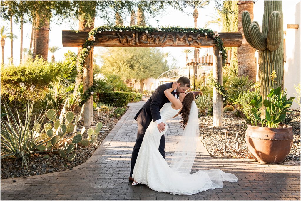 Bride and groom kiss at the Wigwam Resort in Arizona