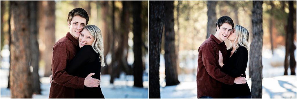 couple embraces and stays warm in each others arms during their winter engagement session in Fox Run Park near Colorado Springs.
