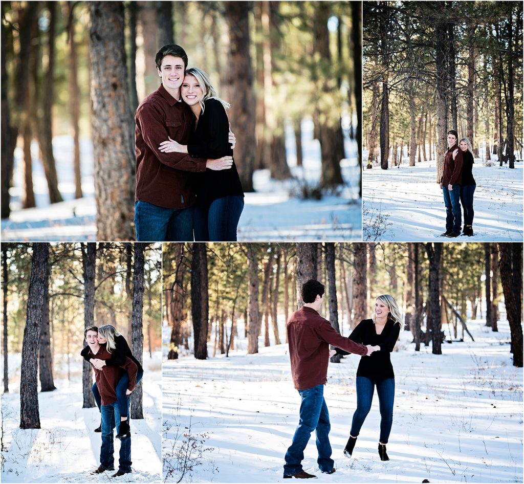 Playful couple dances and laughs during winter in a forest in colorado