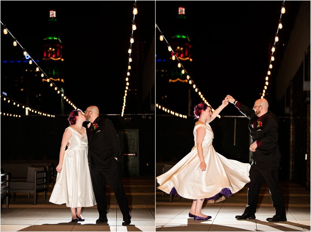 Bride and groom dance at night on a rooftop downtown