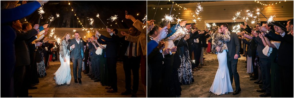 bride and groom walk through guests with sparklers at their sparkler exit at flying horse ranch in larkspur, colorado