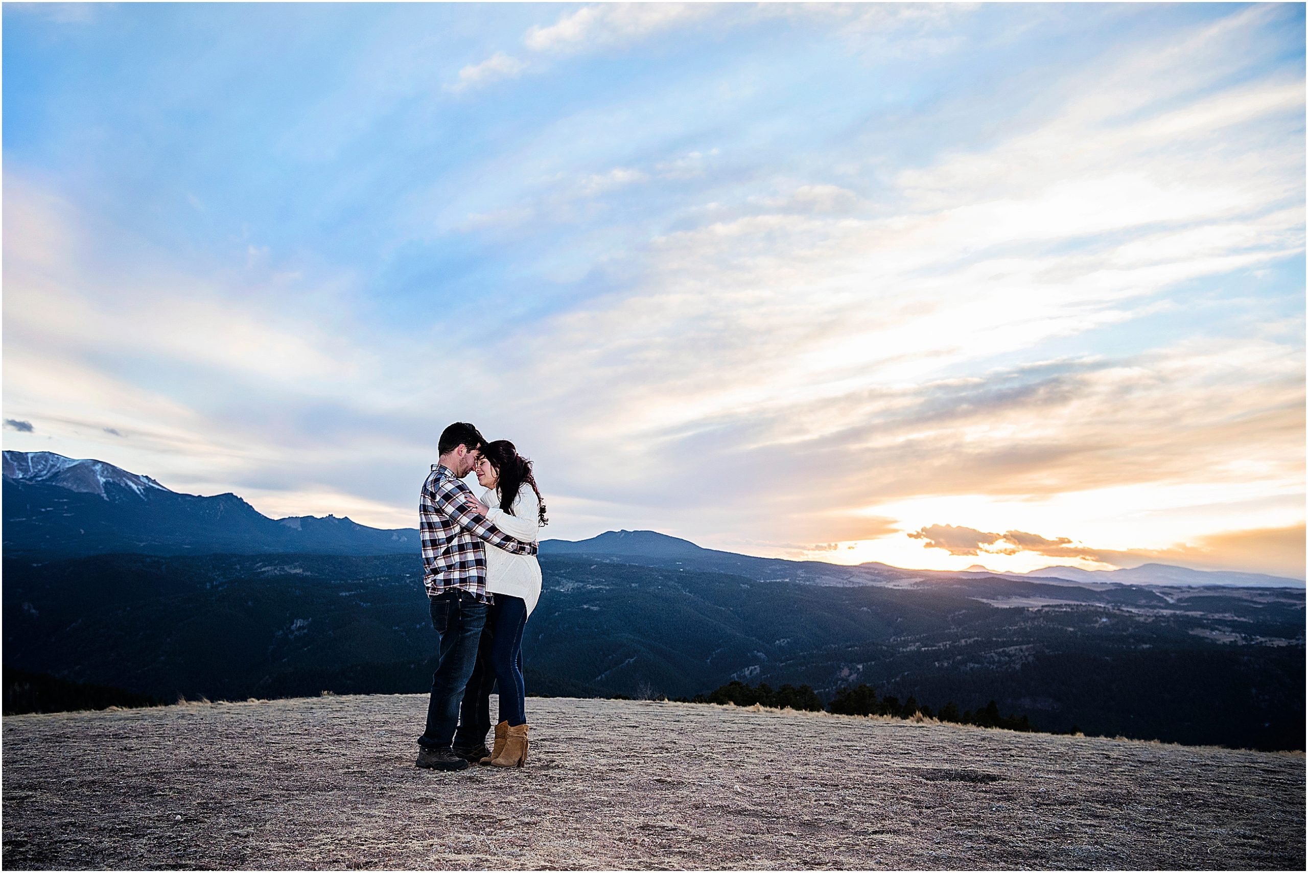 couple in love in the colorado rocky mountains at sunset in winter.