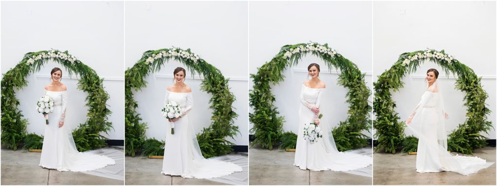 Bride in her off the shoulder gown and a long veil at her indoor winter wedding.