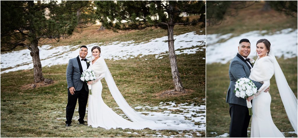 Bryan and Erin stand embracing with snow around them at their wedding during winter