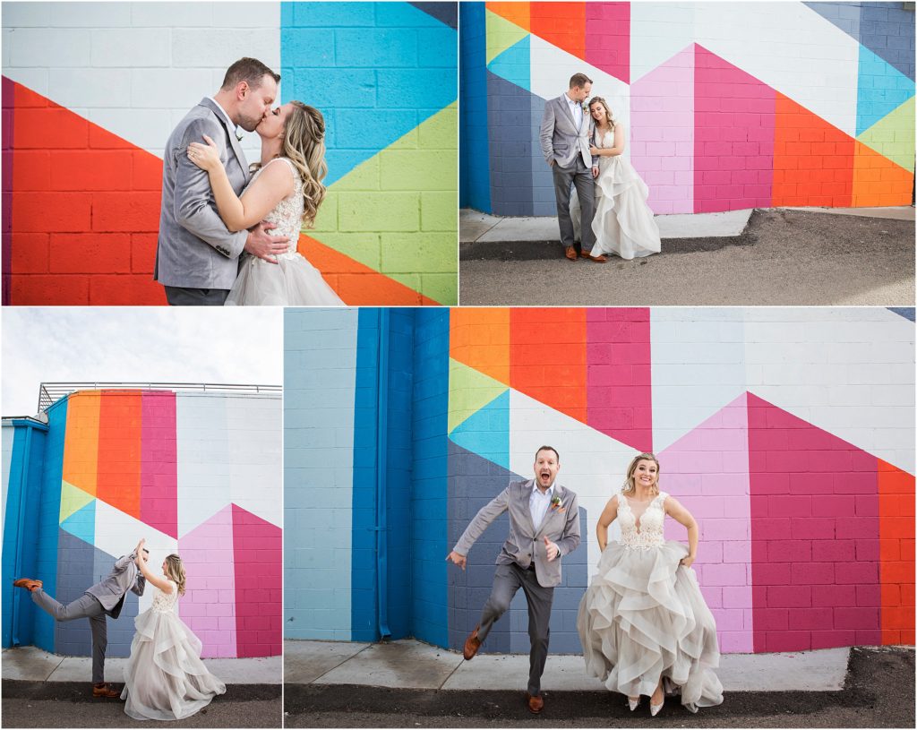 Playful bride and groom embrace the bright colors outside of the Space Annex in Denver
