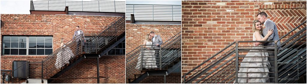 Bride and Groom walk up outdoor staircase on the brick wall side of an urban building in Denver Colorado