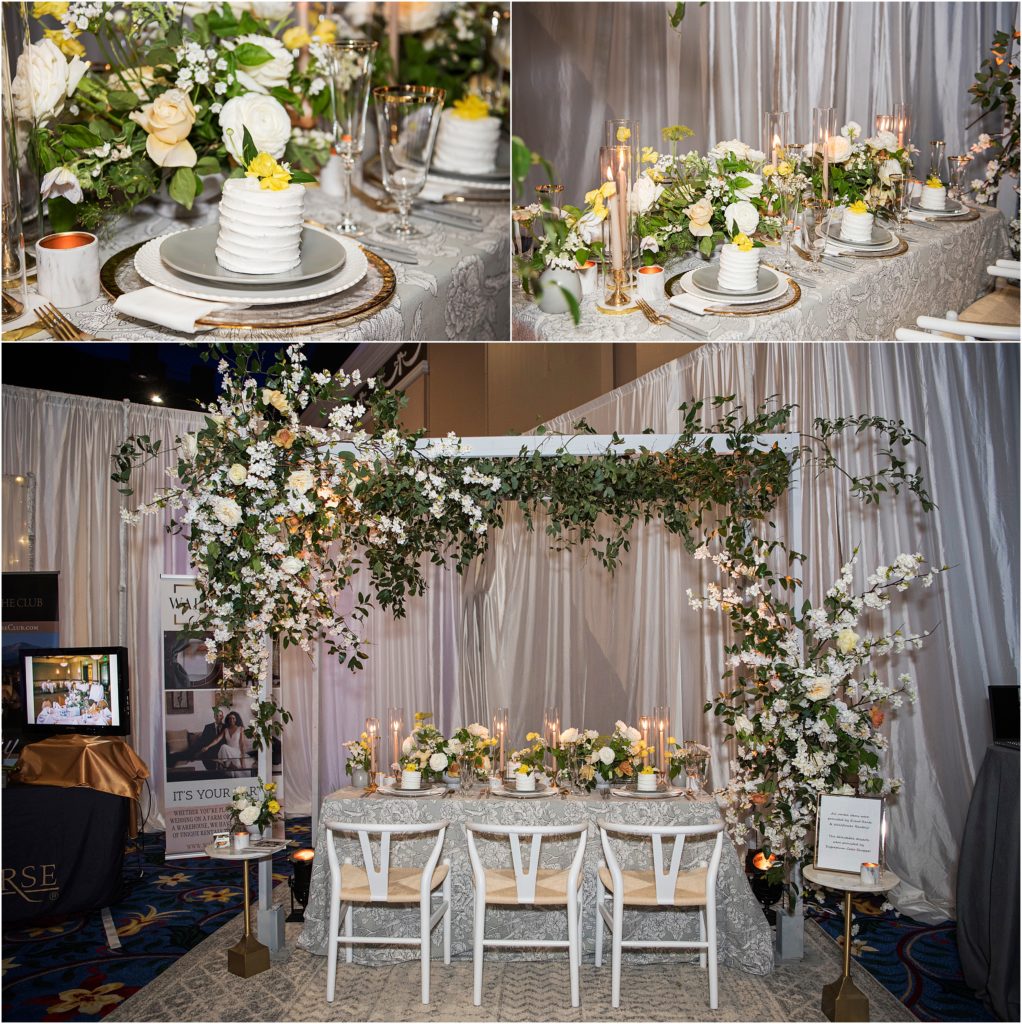Beautiful vendor display with a canopy of florals in yellow and white at the Something New Cheers Bridal Show