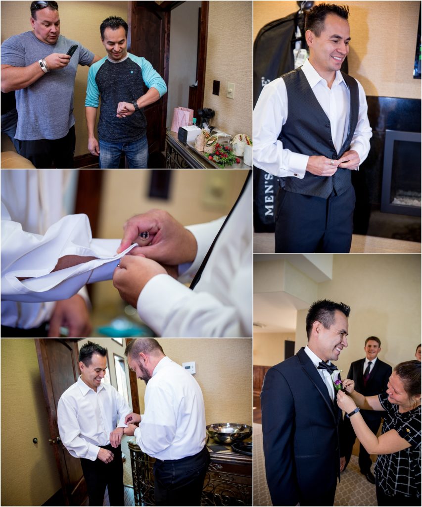A young man is getting ready to tie the knot by fastening his cufflinks, buttons and having his boutonniere pinned.