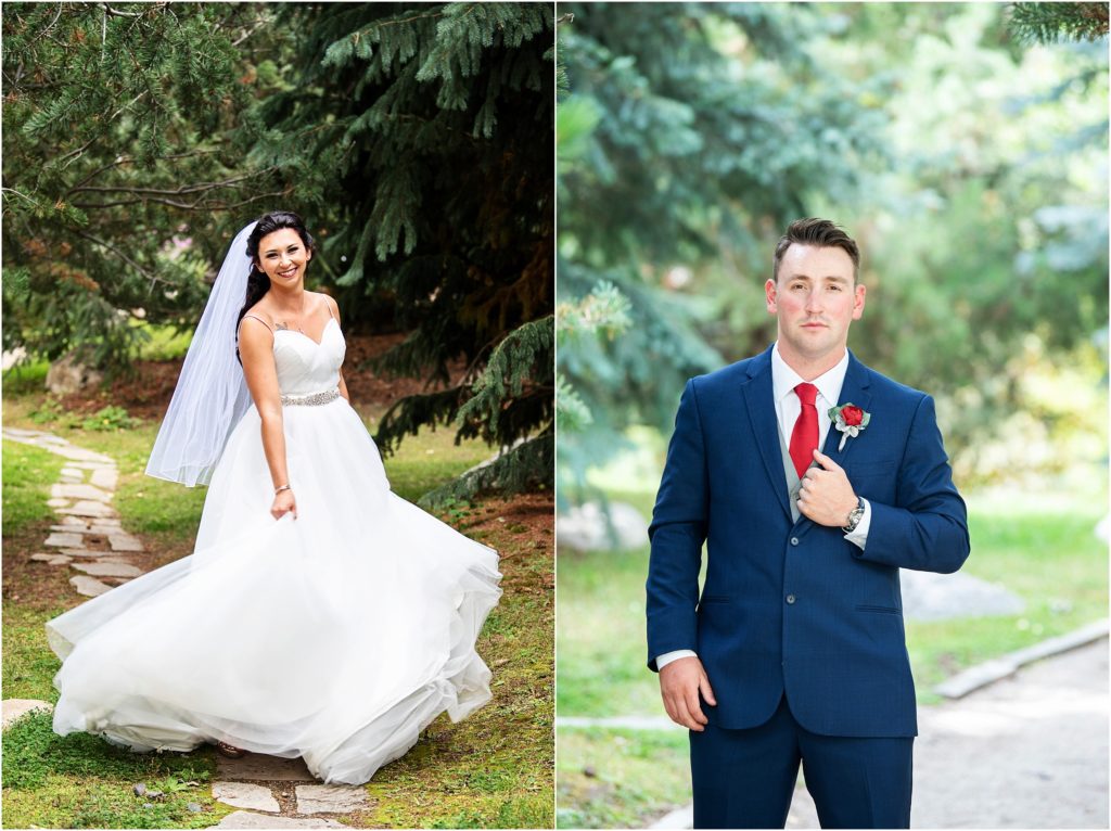 Full, simple wedding dress is stunning against the pine tree backdrop, navy blue suit on groom is highlighted by wooded outdoor ceremony location