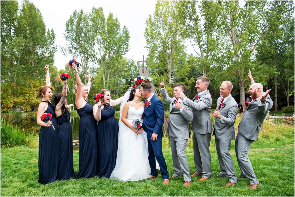 Bridal party celebrates in candid wedding photo following the ceremony
