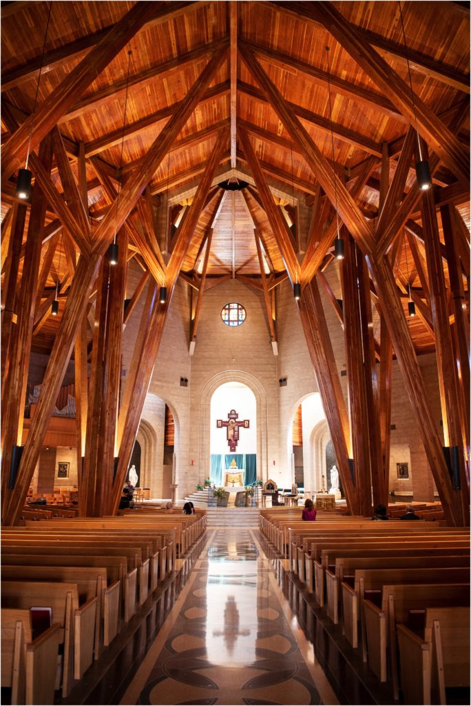 Wood beams are breath-taking in the indoor Colorado church the cathedral ceiling at Our Lady of Loreto in Denver is awe-inspiring