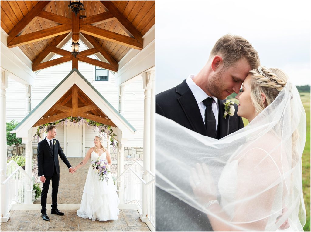 Wedding photo of the bride's veil swooping around the couple, the bride and groom are in a stunning archway with wood beams and hanging floral
