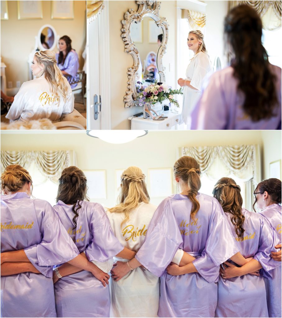 Bride and bridesmaids pose with their silk robes in the bridal suit, the bride has a partial up-do stunning photo captures bride's flawless makeup done by Beauty Bar