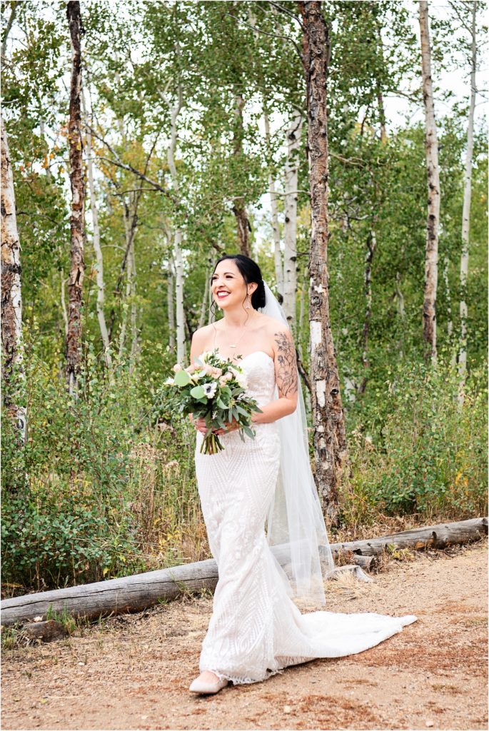 Bride gushes as she walks down the aisle in her simple a line wedding dress