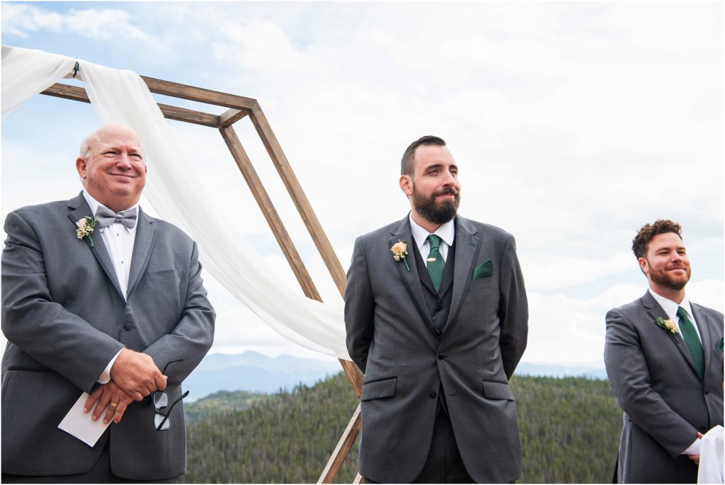 Groom sees his bride for the first time in this wedding photo