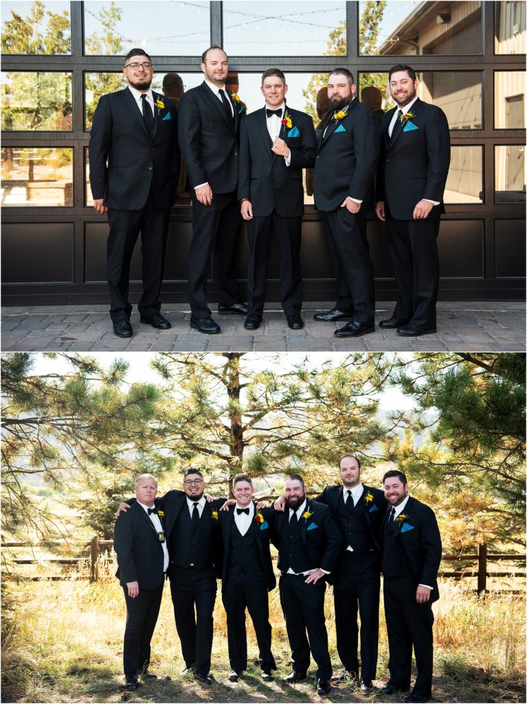 Groom and groomsmen stand together wearing black suits and ties with teal pocket squares and sunflowers