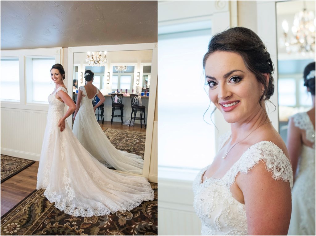 Bride stands in dressing room after putting on her wedding dress