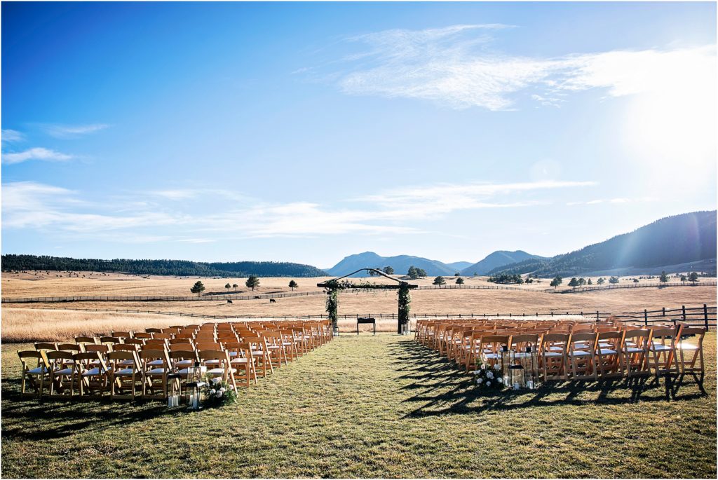 Outdoor ceremony site at Spruce Mountain Ranch with mountain views in bright sunlight