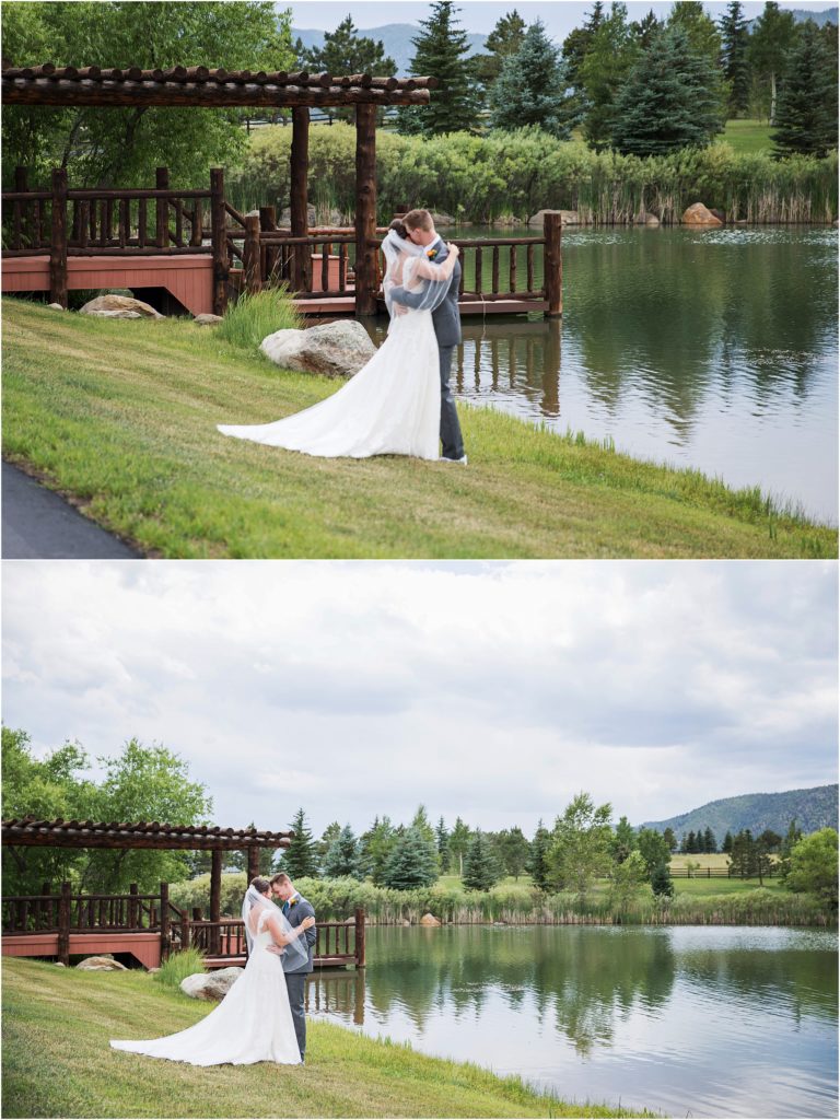 Bride and groom embrace on the shore of a pond at their ranch wedding in the foothills of the Rocky Mountains in Colorado