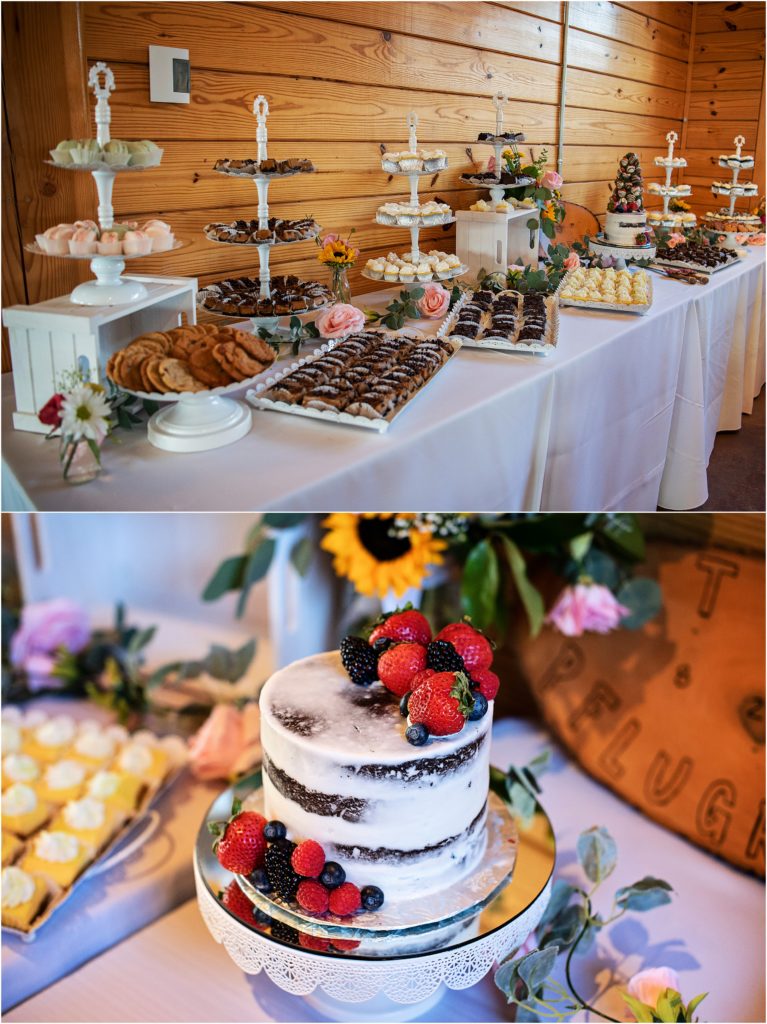 Dessert table filled with a variety of desserts and a simple naked wedding cake with berries on top