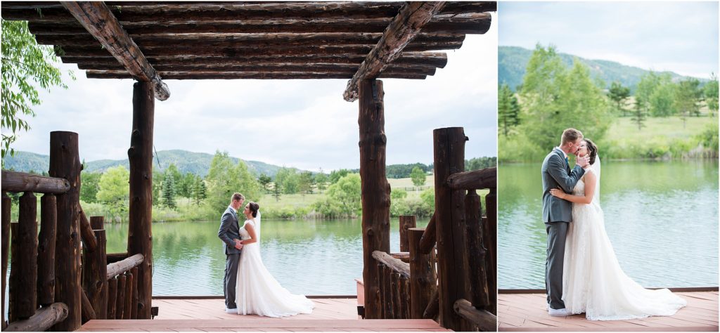 Bride and groom stand on a dock over a pond in summer at Spruce Mountain Ranch in Colorado