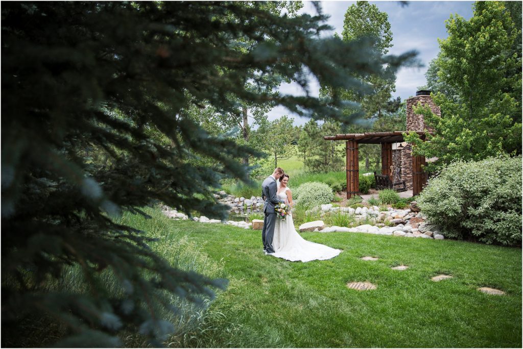 Bride and groom embrace after their first look on their wedding day in Colorado