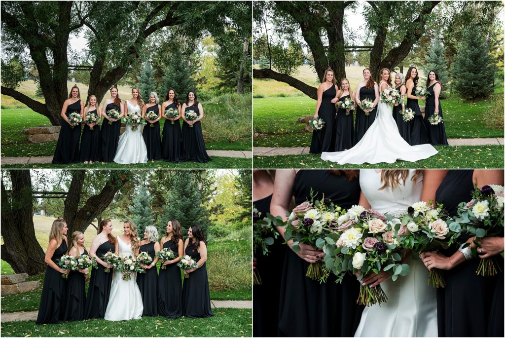 Bride and bridesmaids who are wearing black bridesmaid dresses stand together