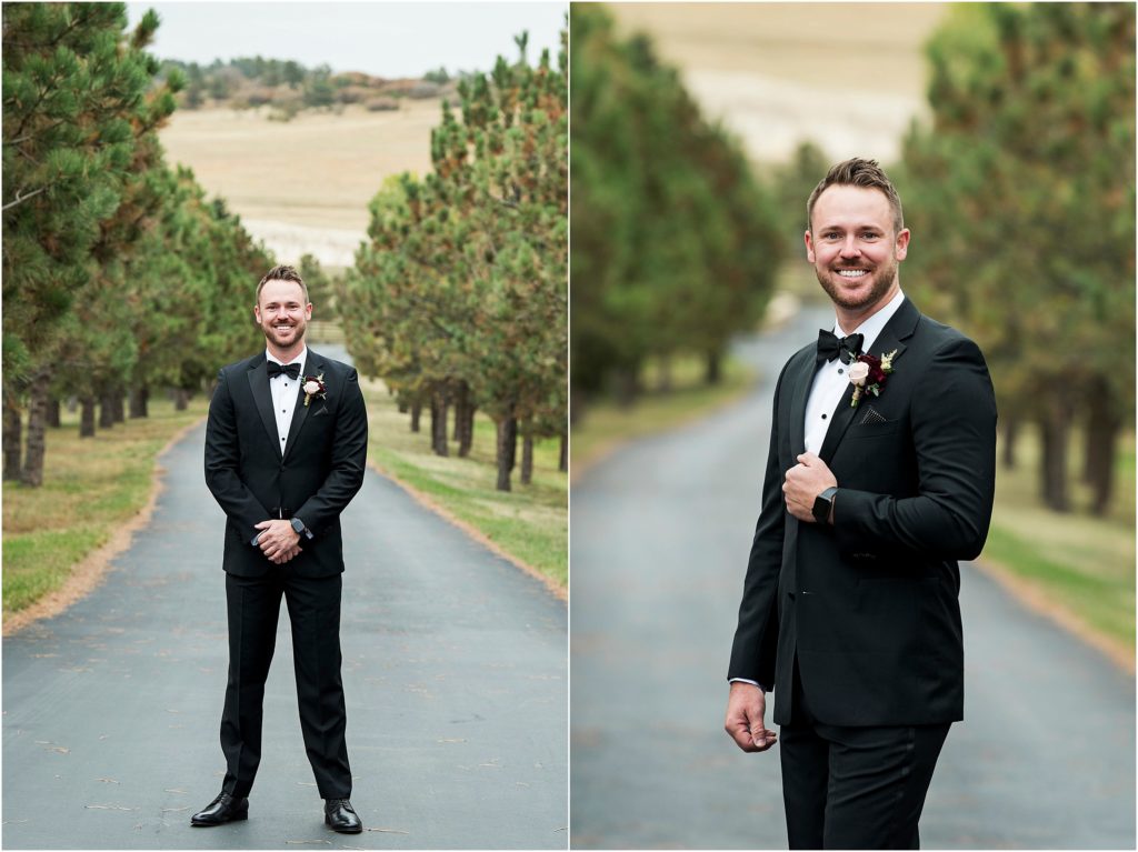 Groom stands dressed and ready with a smile on his face as he prepares for his wedding