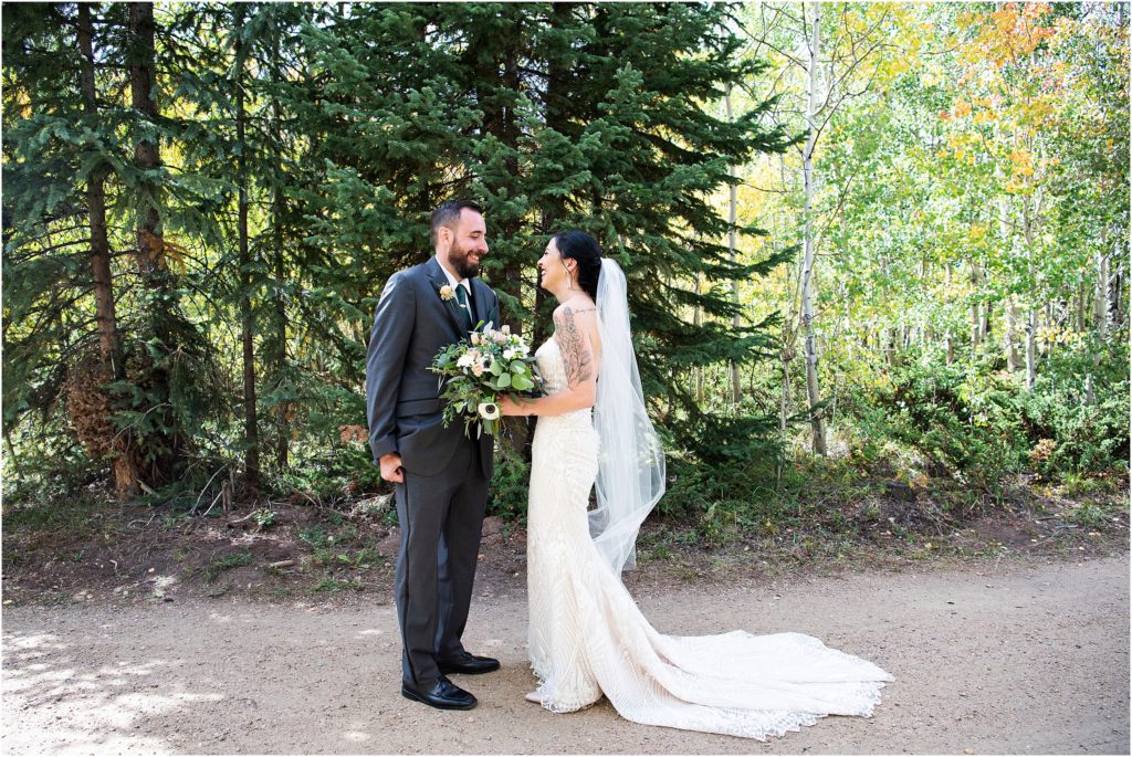 Bride and Groom share a first look on their wedding day in autumn in Colorado