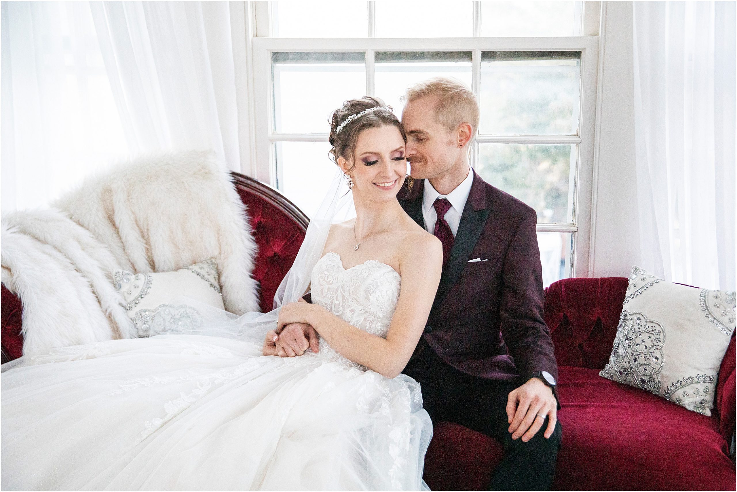 Bride and groom snuggle together for a romantic moment on their wedding day