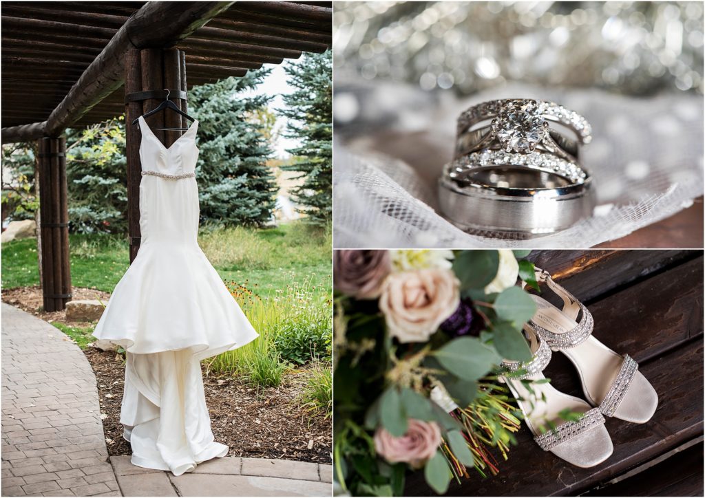 Brides dress hangs beautifully and her ring sparkles next to her shoes and bouquet as she prepares for her wedding at Spruce Mountain Ranch near Denver Colorado.