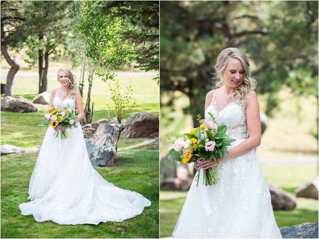 Bride holds bouquet of sunflowers and pink roses as she stands in her wedding dress outside at Flying Horse Ranch